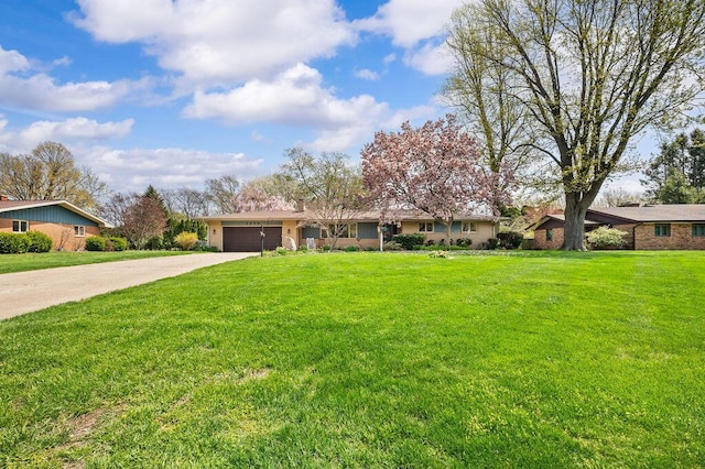 2655 Tanbark Trl, Saint Joseph, MI 49085 - ranch-style home featuring concrete driveway, a garage, and a front lawn