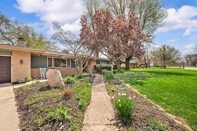 2655 Tanbark Trl, Saint Joseph, MI 49085 - single story home featuring brick siding, a front lawn, and a chimney