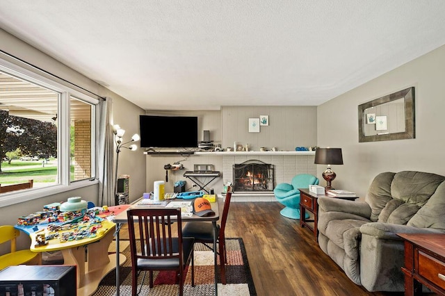 2655 Tanbark Trl, Saint Joseph, MI 49085 - living area featuring wood finished floors and a brick fireplace