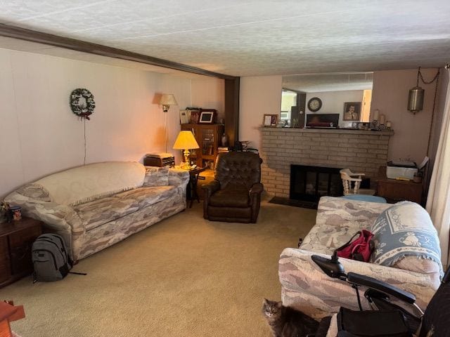 living room with carpet floors, a fireplace, and a textured ceiling