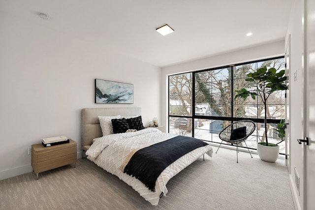 533 E Harrison Ave Unit 18, Royal Oak, MI 48067 - bedroom featuring light carpet and baseboards