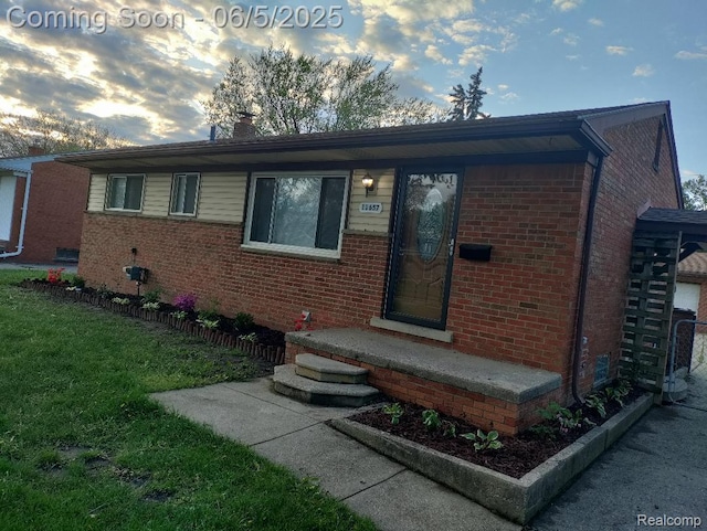 11657 Engleman Rd, Warren, MI 48089 - view of front of home with brick siding and a front lawn