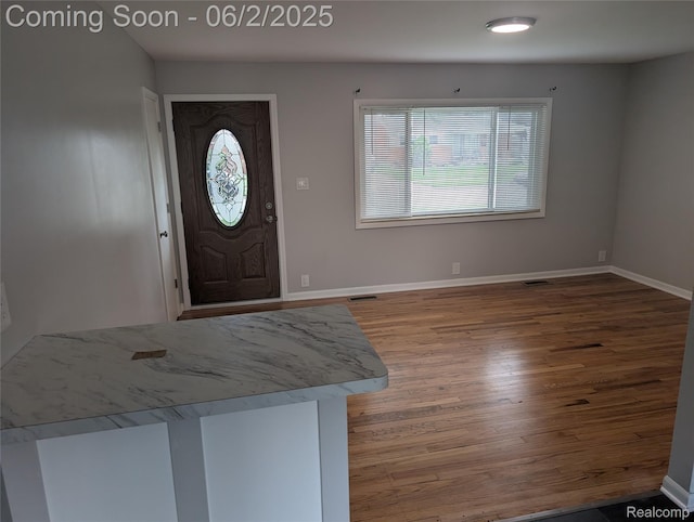 11657 Engleman Rd, Warren, MI 48089 - entrance foyer featuring healthy amount of natural light, wood finished floors, and baseboards