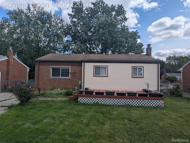 11657 Engleman Rd, Warren, MI 48089 - back of property with a chimney, brick siding, and roof with shingles