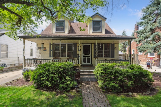 3128 Woodside St, Dearborn, MI 48124 - view of front of property with covered porch, fence, and roof with shingles