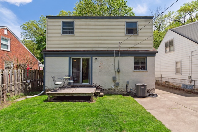 3128 Woodside St, Dearborn, MI 48124 - rear view of house featuring a wooden deck, brick siding, central air condition unit, and a patio