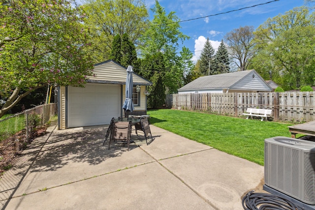 3128 Woodside St, Dearborn, MI 48124 - view of patio / terrace featuring central AC, an outbuilding, and a detached garage