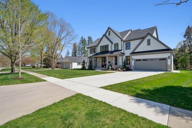 1663 Fairway Dr, Birmingham, MI 48009 - view of front of home featuring a standing seam roof, concrete driveway, stone siding, a front lawn, and metal roof