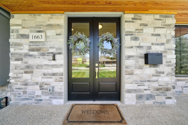 1663 Fairway Dr, Birmingham, MI 48009 - view of exterior entry with french doors and stone siding