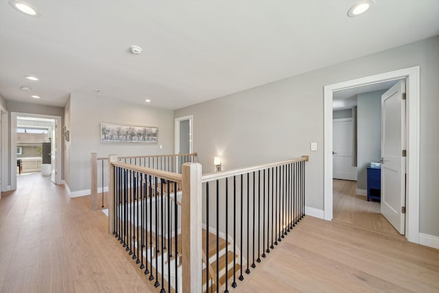 1663 Fairway Dr, Birmingham, MI 48009 - hall with an upstairs landing, light wood-style floors, recessed lighting, and baseboards