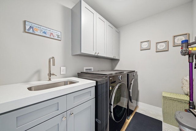 1663 Fairway Dr, Birmingham, MI 48009 - laundry room with washing machine and clothes dryer, cabinet space, and baseboards