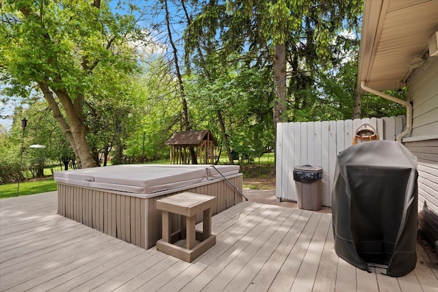 1831 Ansal Dr, Rochester Hills, MI 48309 - wooden deck with a hot tub, view of scattered trees, and area for grilling