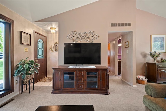 1831 Ansal Dr, Rochester Hills, MI 48309 - living room with vaulted ceiling, light colored carpet, and baseboards