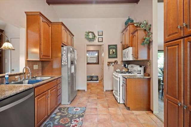 1831 Ansal Dr, Rochester Hills, MI 48309 - kitchen with stainless steel appliances, a sink, backsplash, and brown cabinets