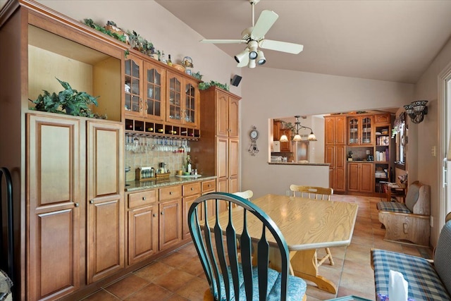 1831 Ansal Dr, Rochester Hills, MI 48309 - kitchen with tasteful backsplash, brown cabinets, glass insert cabinets, lofted ceiling, and ceiling fan