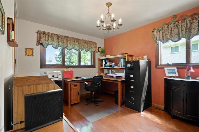 1831 Ansal Dr, Rochester Hills, MI 48309 - home office featuring a chandelier, light wood finished floors, and healthy amount of natural light