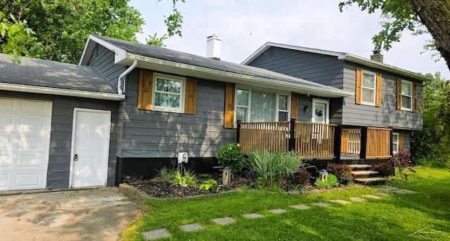 7141 Nichols Rd, Flushing, MI 48433 - split level home featuring a chimney and a front lawn