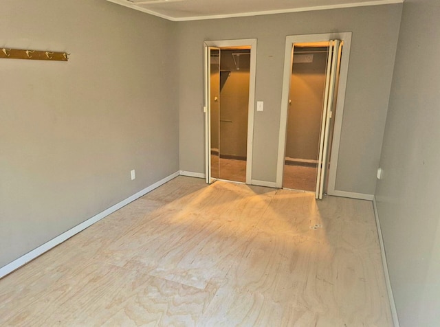 3188 Bessie St, Auburn Hills, MI 48326 - unfurnished bedroom featuring baseboards and ornamental molding