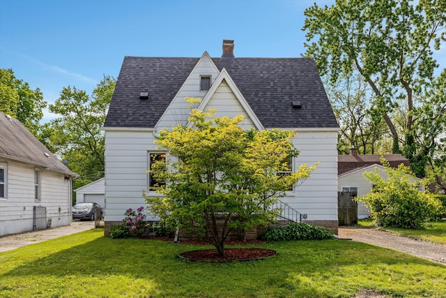 19319 Centralia, Redford, MI 48240 - view of front of house featuring a front lawn, a chimney, and roof with shingles