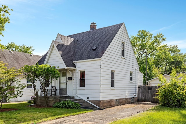 19319 Centralia, Redford, MI 48240 - view of front of property with a shingled roof and a chimney
