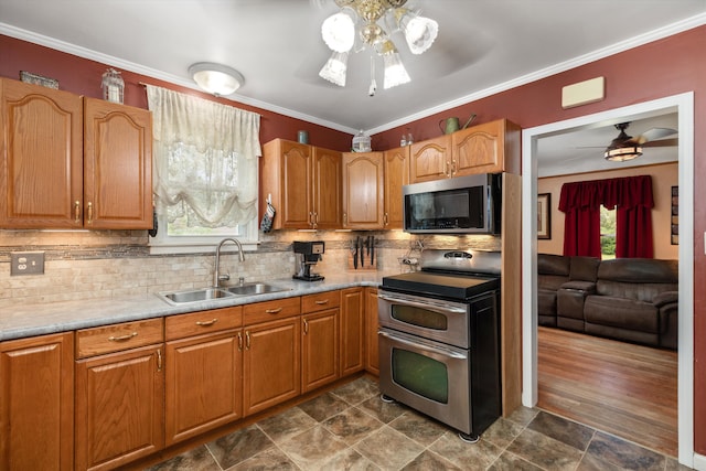 19319 Centralia, Redford, MI 48240 - kitchen featuring appliances with stainless steel finishes, a ceiling fan, a sink, light countertops, and tasteful backsplash