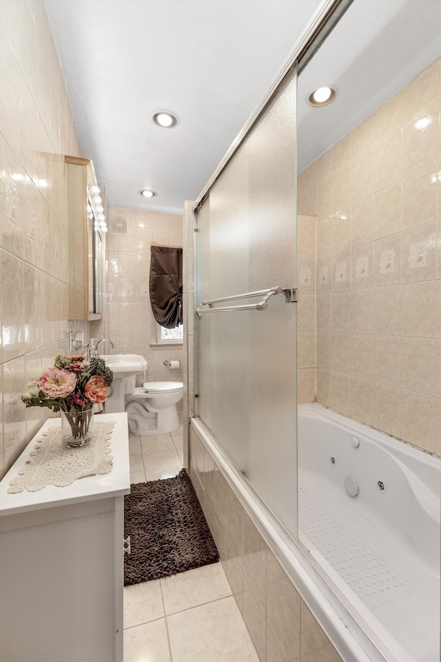 19319 Centralia, Redford, MI 48240 - bathroom with tile patterned floors, toilet, a combined bath / shower with jetted tub, tile walls, and recessed lighting
