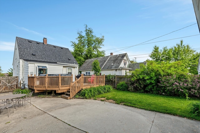 19319 Centralia, Redford, MI 48240 - rear view of property featuring a patio, a wooden deck, a chimney, roof with shingles, and outdoor dining space