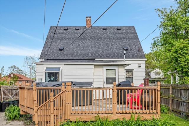 19319 Centralia, Redford, MI 48240 - rear view of house with a shingled roof, a wooden deck, a fenced backyard, and a chimney