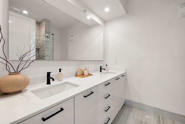 533 E Harrison Ave Unit 20, Royal Oak, MI 48067 - bathroom with baseboards, double vanity, recessed lighting, and a shower