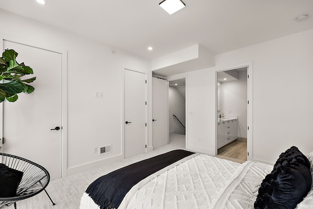 533 E Harrison Ave Unit 20, Royal Oak, MI 48067 - bedroom featuring recessed lighting, light carpet, ensuite bath, and baseboards