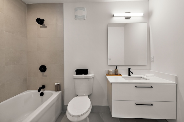533 E Harrison Ave Unit 20, Royal Oak, MI 48067 - bathroom featuring toilet, vanity, baseboards, tile patterned flooring, and  shower combination