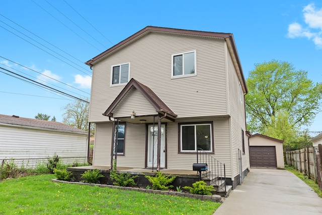 27733 Kaufman St, Roseville, MI 48066 - view of front of house featuring a porch, a garage, concrete driveway, and an outbuilding