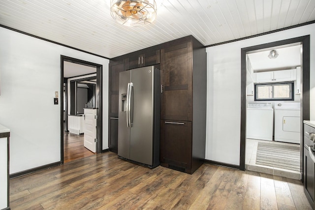 kitchen with stainless steel fridge with ice dispenser, separate washer and dryer, dark brown cabinets, baseboards, and wooden ceiling