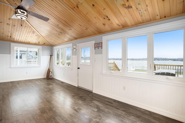 unfurnished sunroom with lofted ceiling and a water view