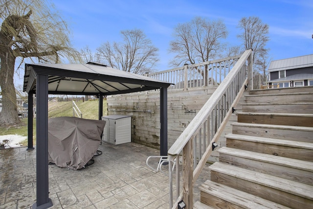 view of patio / terrace with a gazebo and stairway