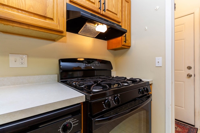 41944 Cherry Hill Rd, Novi, MI 48375 - kitchen with black gas range, under cabinet range hood, light countertops, and brown cabinetry