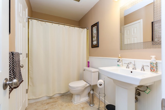 41944 Cherry Hill Rd, Novi, MI 48375 - bathroom with a wainscoted wall, toilet, a shower with curtain, and tile patterned flooring