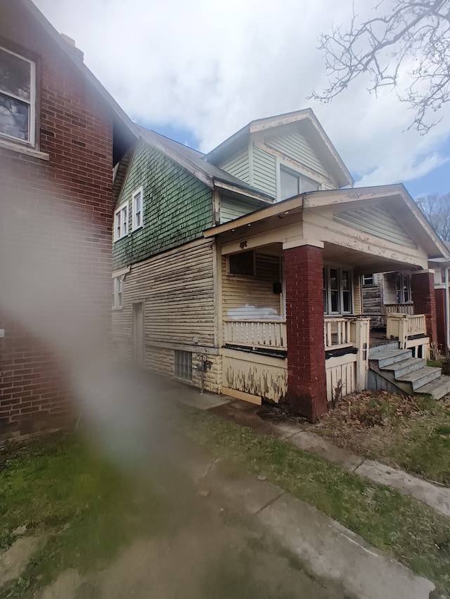 9591 American St, Detroit, MI 48204 - view of property exterior with covered porch