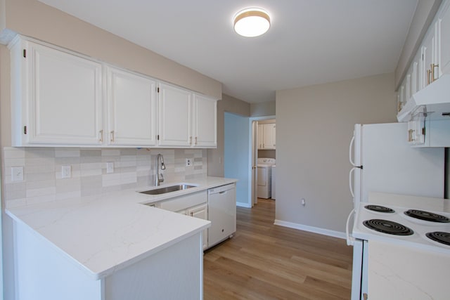 37374 Stonegate Cir, Clinton Township, MI 48036 - kitchen with white appliances, washer / dryer, baseboards, a sink, and light wood-type flooring