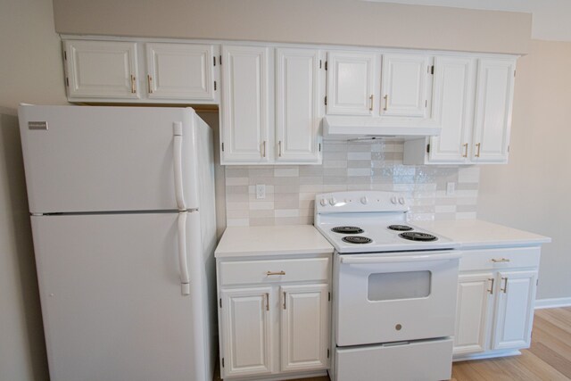 37374 Stonegate Cir, Clinton Township, MI 48036 - kitchen with white appliances, under cabinet range hood, decorative backsplash, and white cabinets