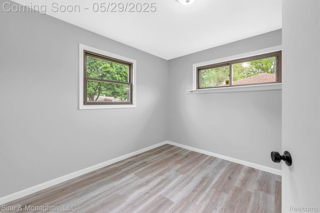 2514 Hearthside Dr, Ypsilanti, MI 48198 - unfurnished room featuring healthy amount of natural light, wood finished floors, and baseboards