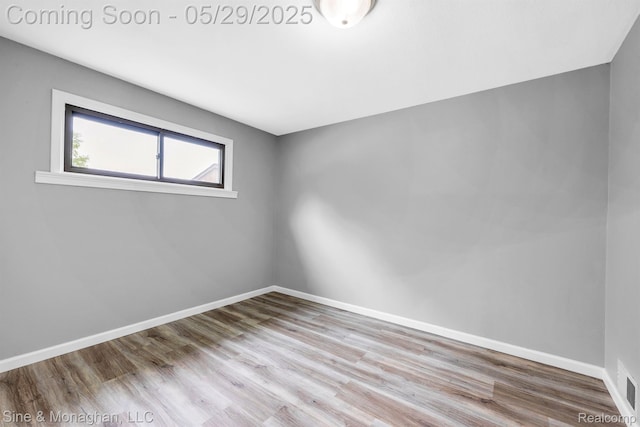 2514 Hearthside Dr, Ypsilanti, MI 48198 - empty room featuring wood finished floors and baseboards