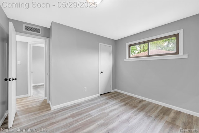 2514 Hearthside Dr, Ypsilanti, MI 48198 - unfurnished bedroom with light wood finished floors, baseboards, and a closet