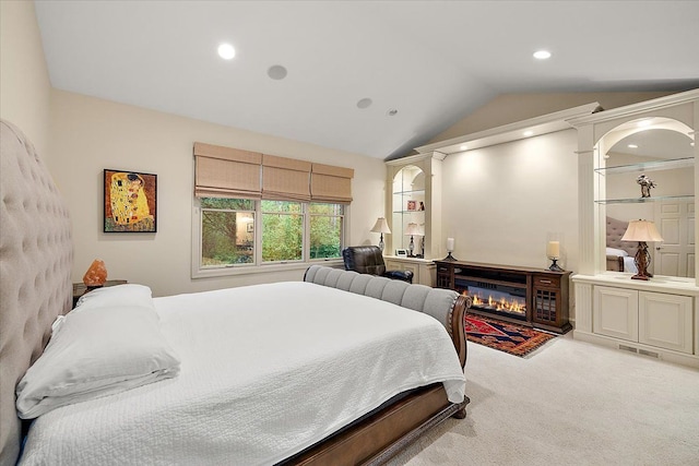 4735 Oakhurst Ridge Rd, Clarkston, MI 48348 - carpeted bedroom with lofted ceiling, a glass covered fireplace, and recessed lighting