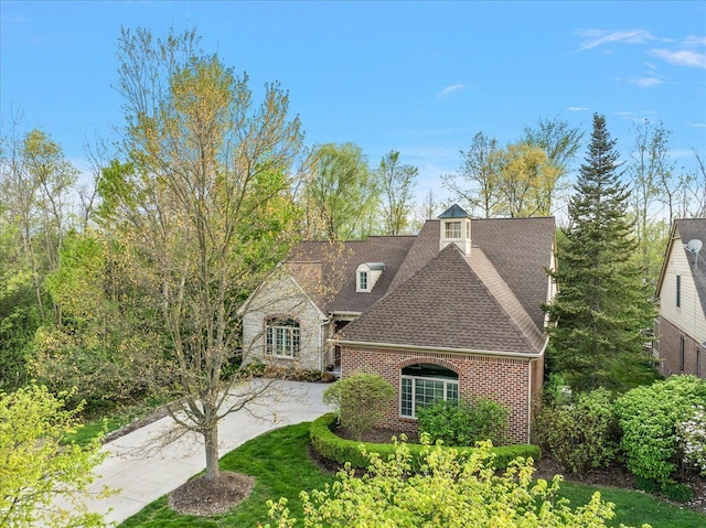4735 Oakhurst Ridge Rd, Clarkston, MI 48348 - view of front of property with brick siding and a shingled roof