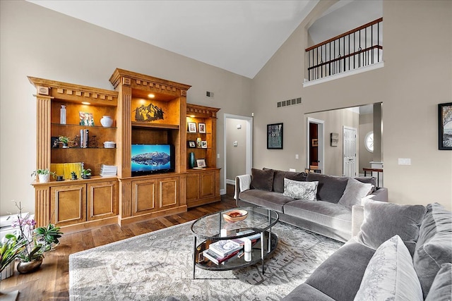 4735 Oakhurst Ridge Rd, Clarkston, MI 48348 - living area featuring wood finished floors and high vaulted ceiling
