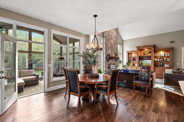 4735 Oakhurst Ridge Rd, Clarkston, MI 48348 - dining room featuring a chandelier, dark wood-style flooring, and vaulted ceiling