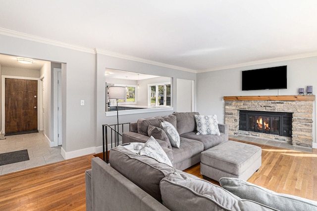 926 Brighton Lake Rd, Brighton, MI 48116 - living area with wood finished floors, crown molding, a stone fireplace, and baseboards