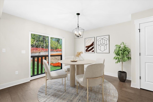 2080 Crested Butte Dr, White Lake, MI 48383 - dining room featuring a chandelier, baseboards, and dark wood-style flooring