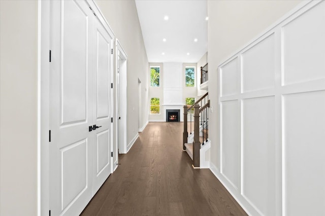 2080 Crested Butte Dr, White Lake, MI 48383 - hall featuring dark wood finished floors, stairway, recessed lighting, and baseboards